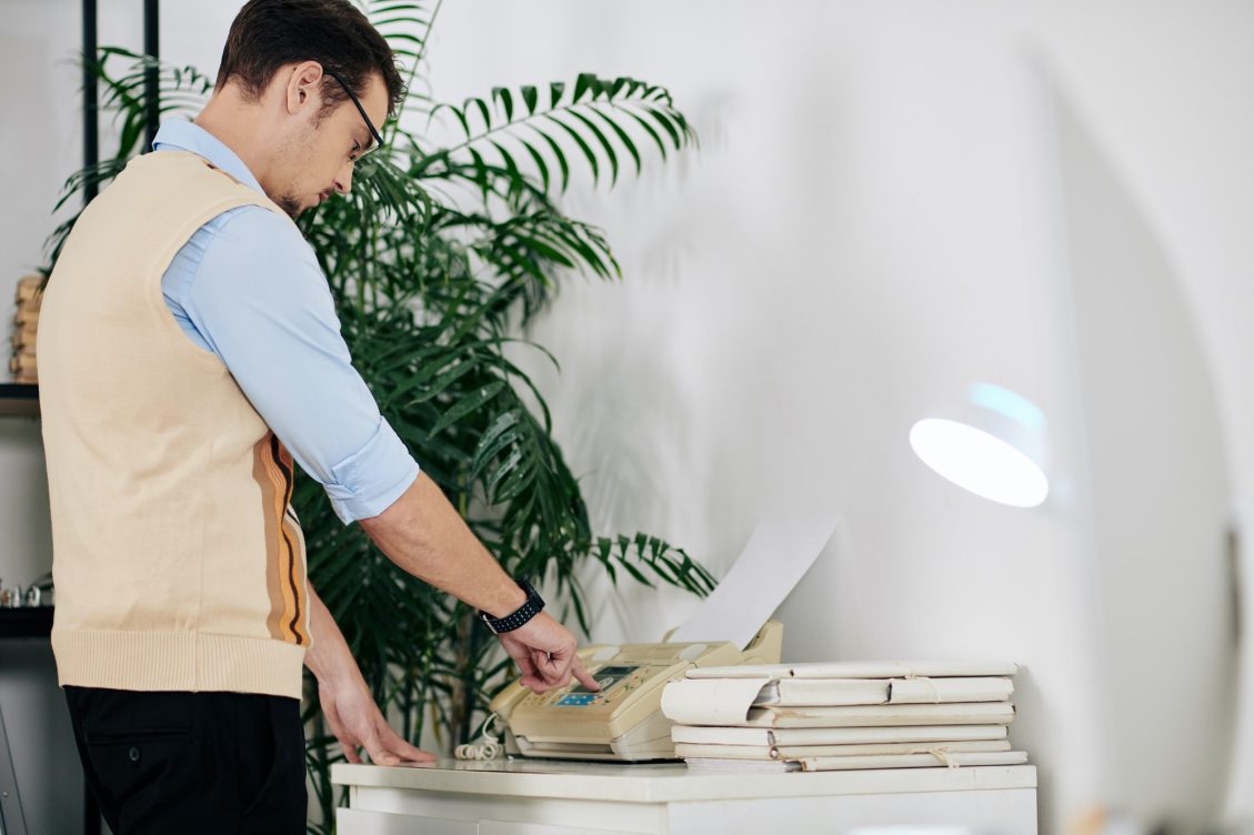 Businessman receiving fax